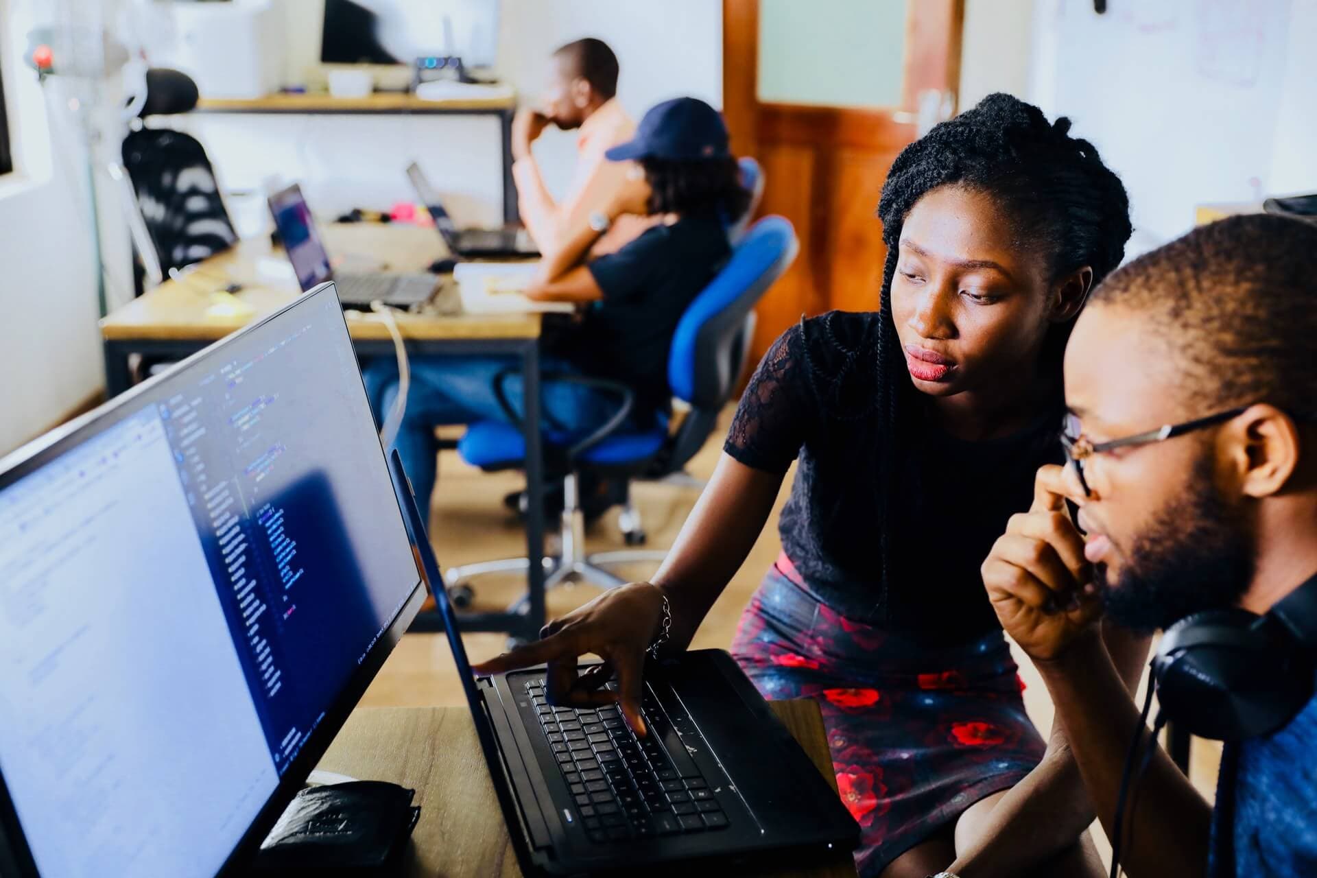 two no code developers working together