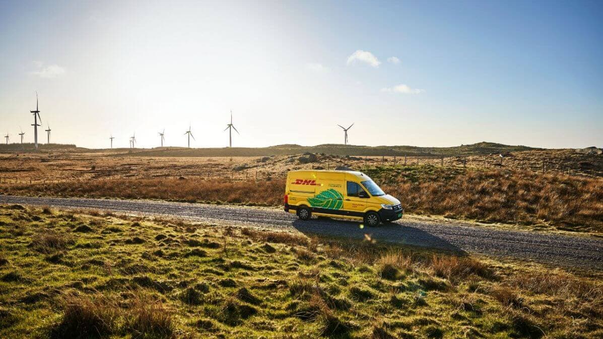 DHL delivery can driving on a road